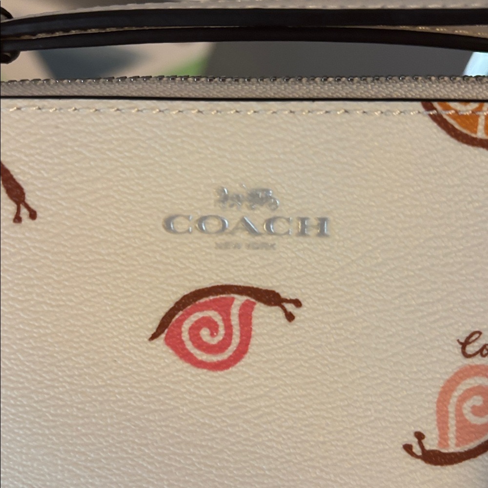 Like New Corner Zip Wristlet in chalk with snail print - Picture 3 of 3